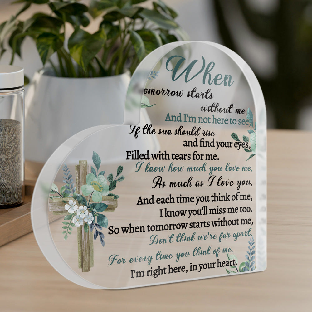 Decorative plaque with a poem and cross design on a wooden surface.