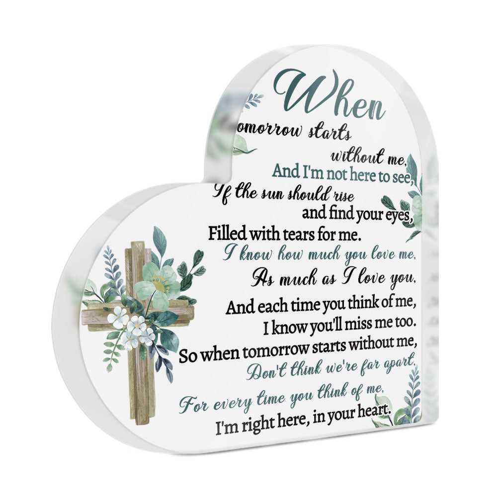 Memorial plaque with cross design and text on a white background