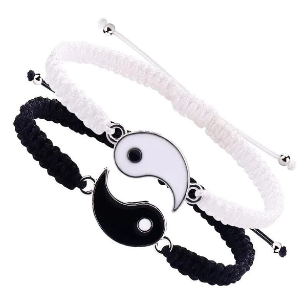 Pair of Best Friend Couple Matching Yin Yang Adjustable Cord Bracelets, featuring one black and one white bracelet, placed together to form a complete yin yang symbol.