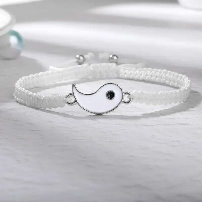 Close-up of the white bracelet from the Best Friend Couple Matching Yin Yang Adjustable Cord Bracelets, featuring a half yin yang charm on an adjustable cord.